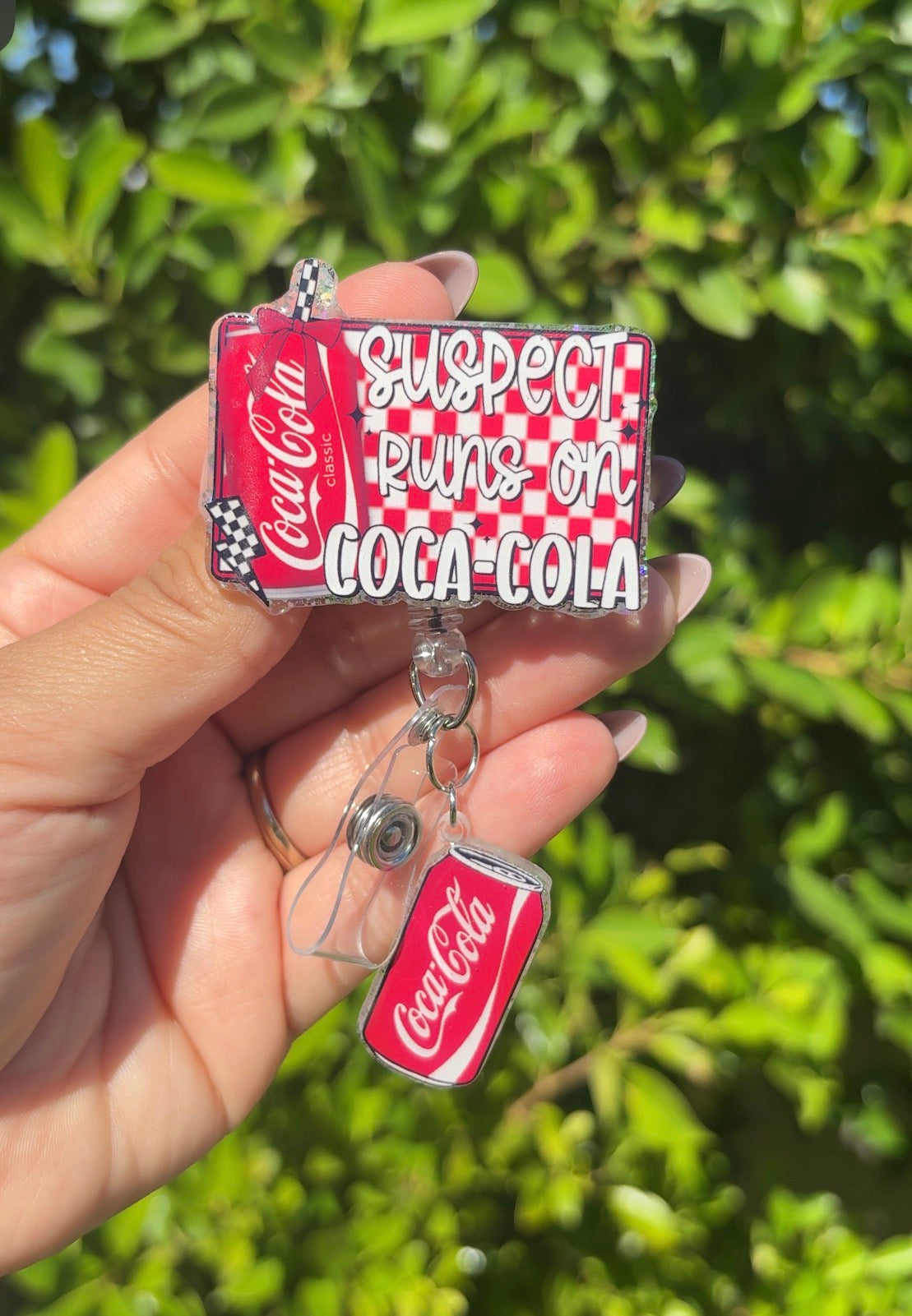 Suspect Coca Cola Badge Reel